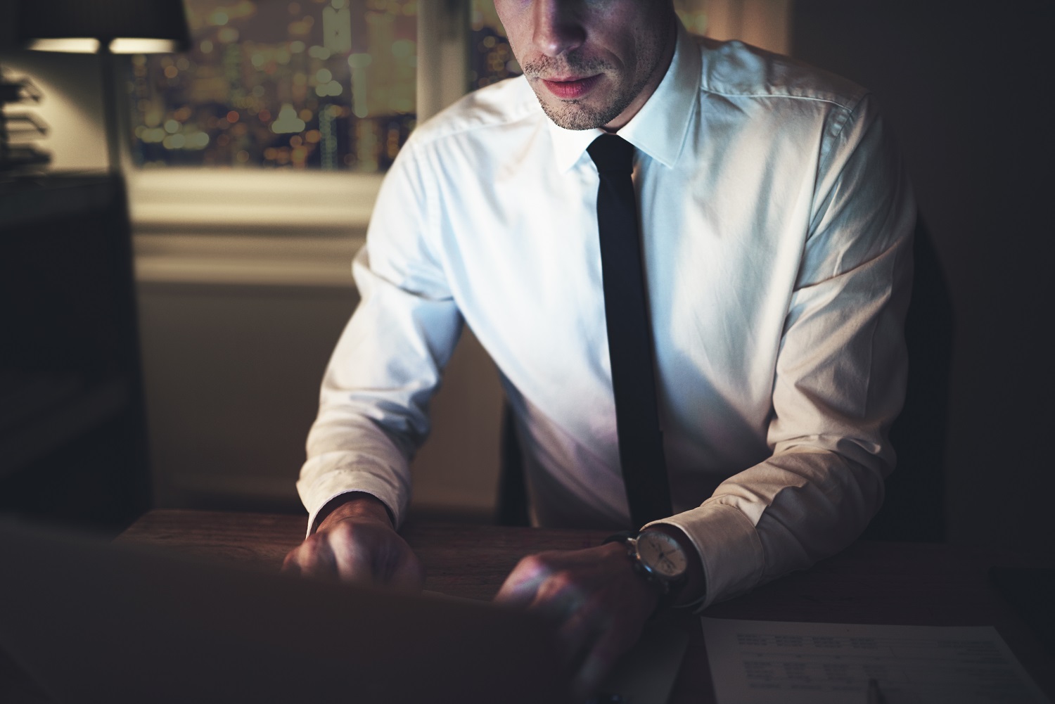 The Lawyer Sitting At Workplace And Typing - Escritório de Advocacia em Fortaleza - CE | Guerra Advogados